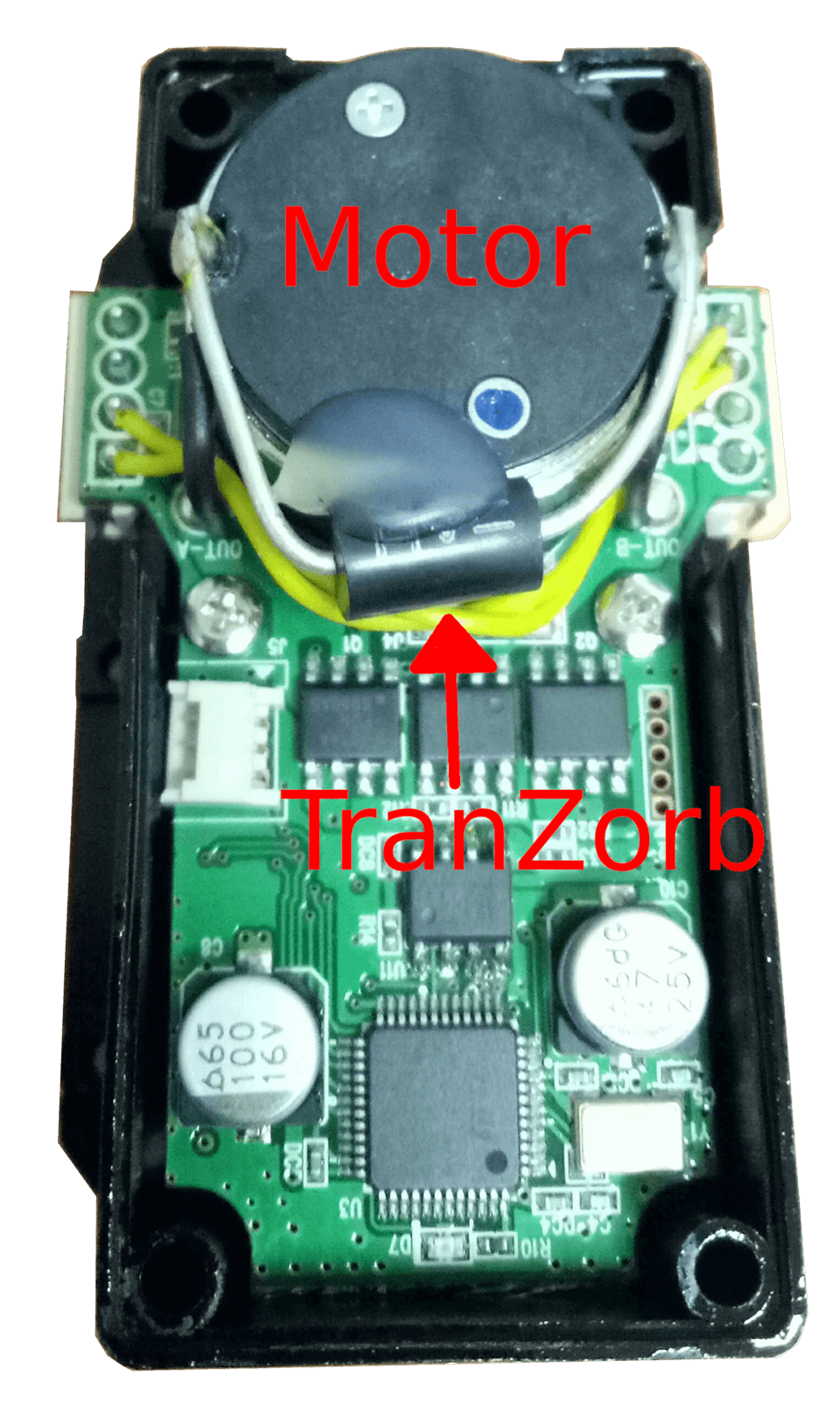 Top view of the mounted TranZorb. The two arms of the TranZorb are soldered to the motor terminals. Hot glue is added to stabilise the TranZorb against shocks and vibrations.